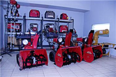 Honda snowblowers lined up on the showroom floor